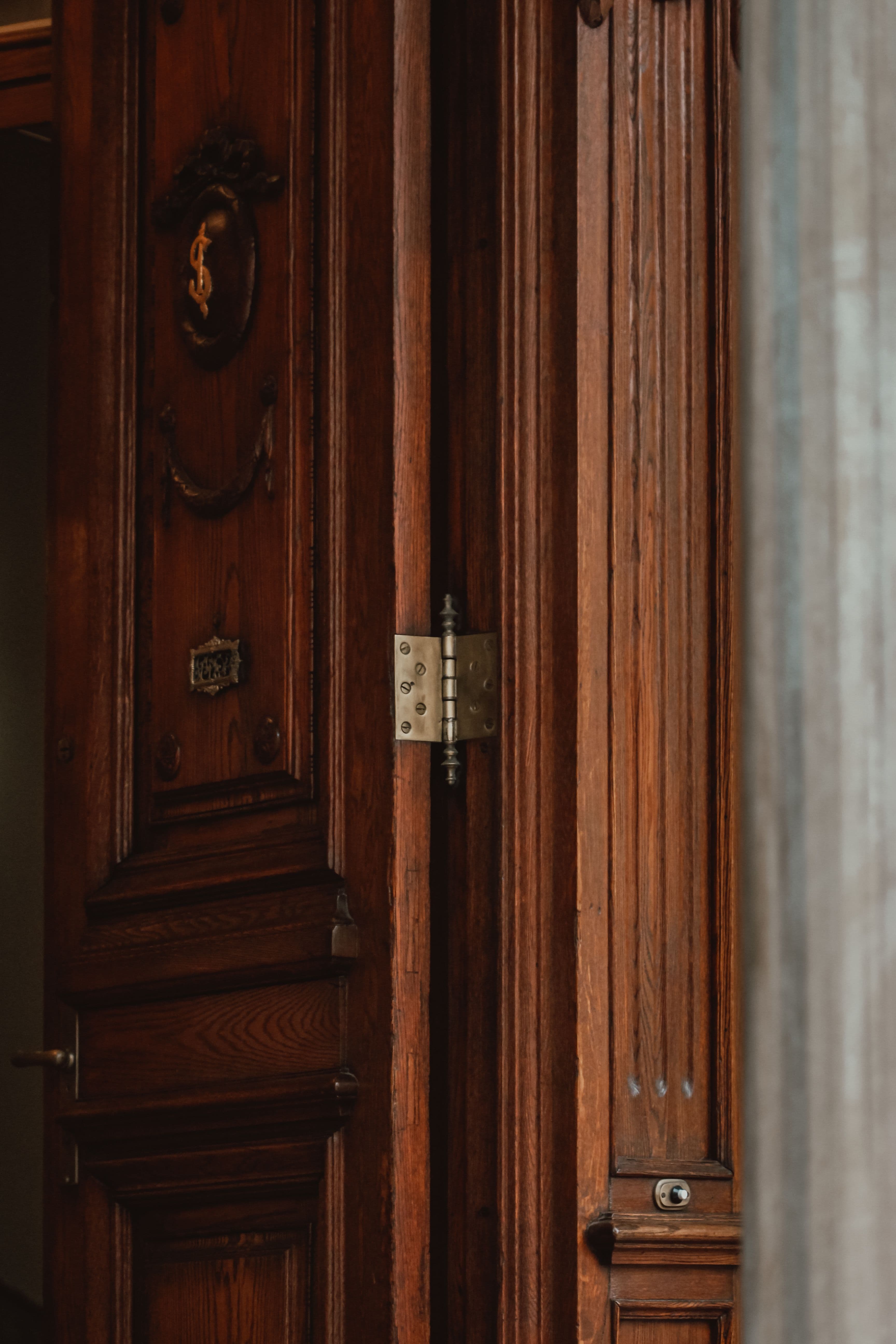Premium door hinge installed on elegant wooden door